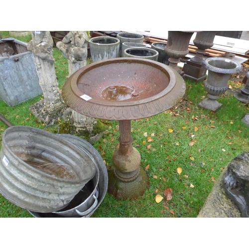 8087 - A cast iron birdbath, egg and dart rim, 68cm tall