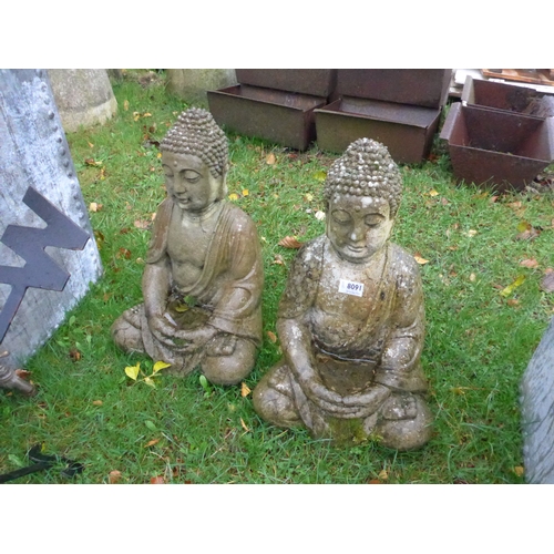 8091 - Two weathered composition seated Buddhas, 45cms tall