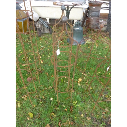 8103 - A pair of steel rust finish ball top obelisks