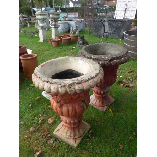 8146 - A pair of painted reconstituted garden urns, 65cm tall