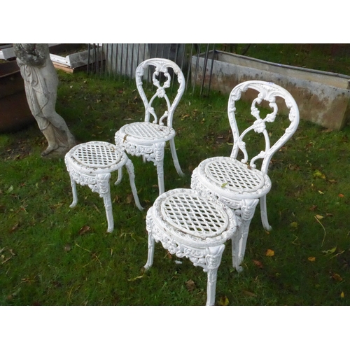 8171 - A pair of decorative cast alloy garden chairs and matching low tables