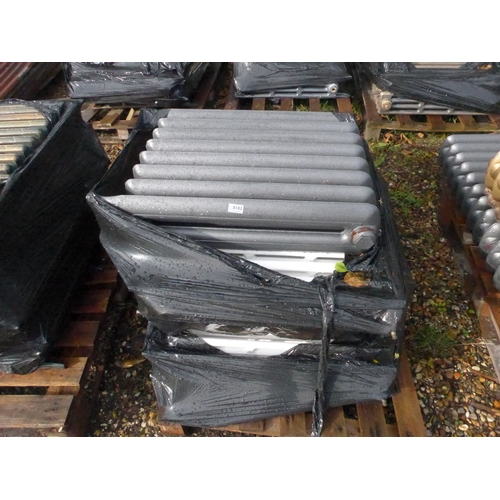 8182 - A pallet containing four reclaimed cast iron radiators