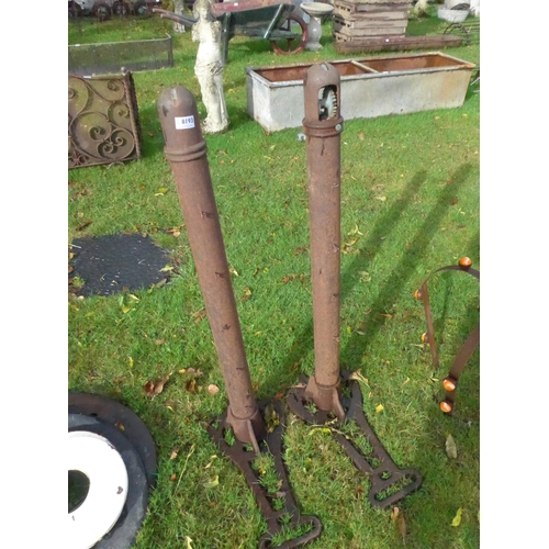 8193 - A pair of cast iron tennis posts