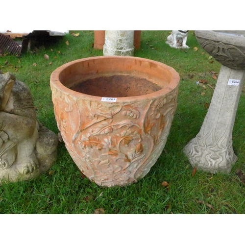 8205 - A terracotta foliate planter, 44cm tall, 44cm diameter at top