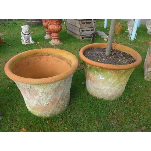 8207 - A pair of terracotta basket weave planters, 47cm tall, 60cm diameter at top