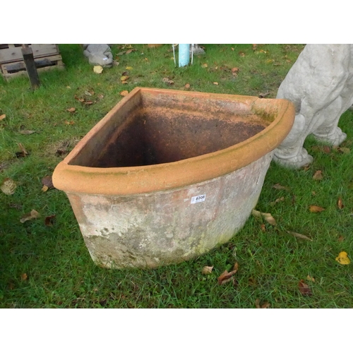 8208 - A terracotta wedge shaped planter, 40cm tall