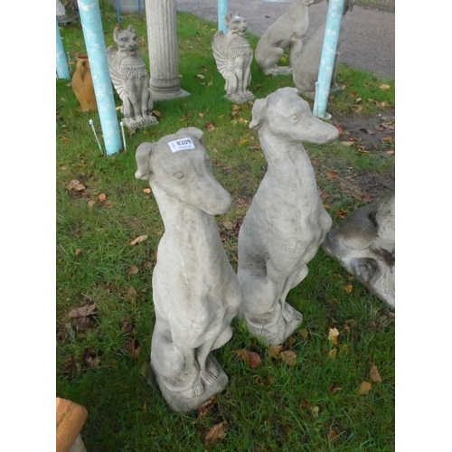 8209 - A pair of composition seated hounds, 74cm tall