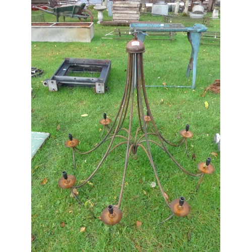 8225 - A large wrought iron eight arm electrolier