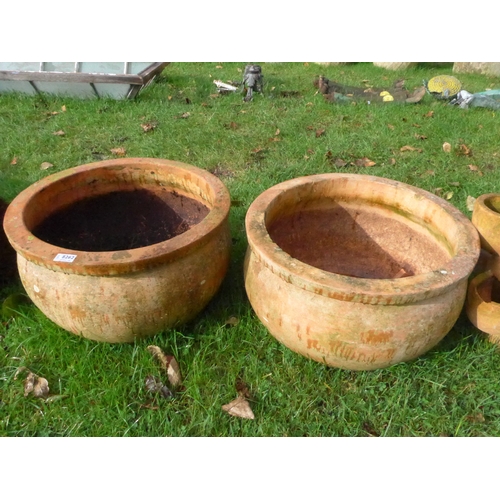 8262 - A pair of bulbous terracotta pots with feet, 30cm x 52cm diameter