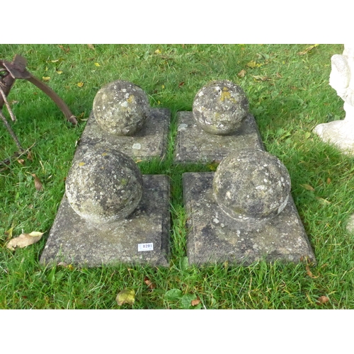 8291 - A set of four ball pier caps on square bases, 34cm x 34cm base