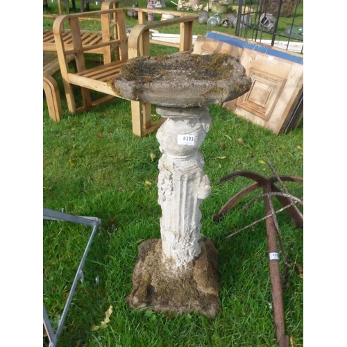 8293 - A two piece reconstituted bird bath with naturalistic column base, 78cm tall