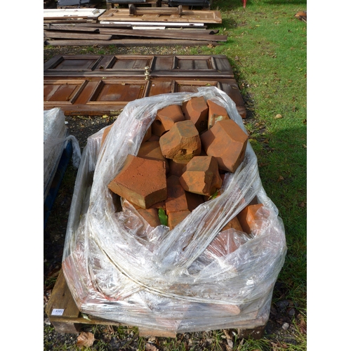 8303 - A pallet of shaped chimney bricks