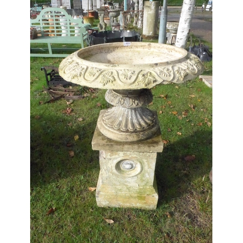 8335 - A buff terracotta shallow urn on plinth, decorative foliate detail to rim, 98cm tall