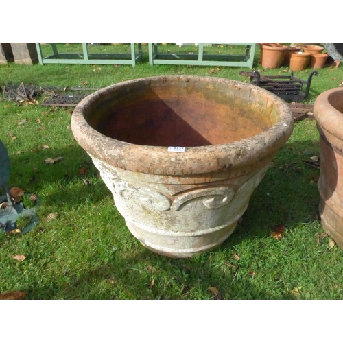 8337 - A large terracotta planter with floral detail, 56cm tall, 70cm diameter