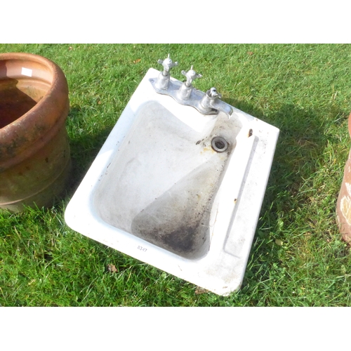 8347 - A Victorian cast iron enamelled sink with chrome taps