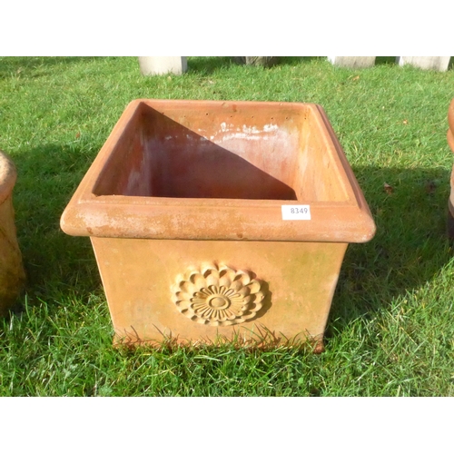 8349 - A square terracotta pot with floral decoration, 45cm x 45cm x 39cm