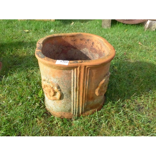 8360 - A shaped terracotta planter with Tudor rose roundels, 27cm tall