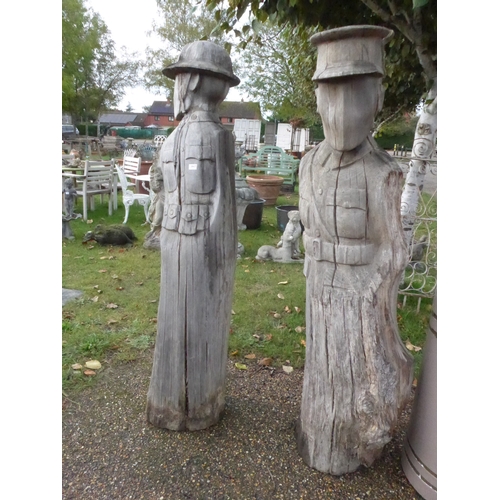 8437 - Two carved oak trunks as First World War soldiers, approx 170cm tall