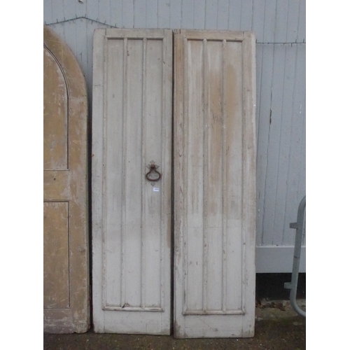 8450 - A pair of French fluted doors with iron latch, 214cm x 65cm each door