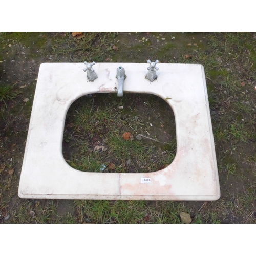 8457 - A marble basin surround with chrome Deco style taps