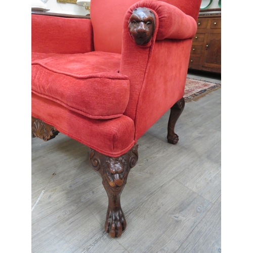 4167 - A pair of late 18th/early 19th Century armchairs, lion mask arms and knees, lion paw feet, upholster... 