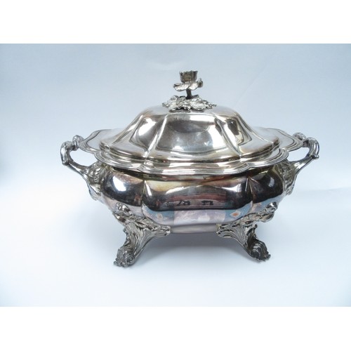 4190 - A silver plated soup tureen, the lid surmounted by a flower with crested crown and eagle detail. The... 