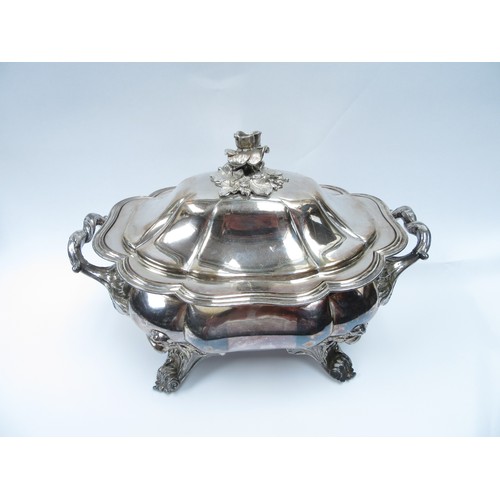 4190 - A silver plated soup tureen, the lid surmounted by a flower with crested crown and eagle detail. The... 