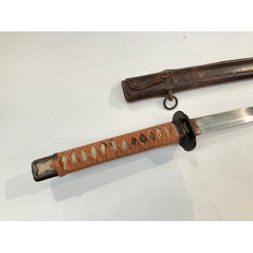 9372 - A Japanese katana, ray skin grip wrapped in cloth, iron tsuba with copper foliage, the tang unsigned... 