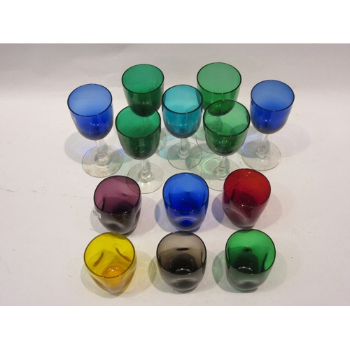 4421 - Seven coloured drinking glasses and a set of six coloured tumblers