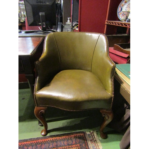 4002 - A Georgian mahogany serpentine front leather desk armchair with piping and brass stud decoration ove... 