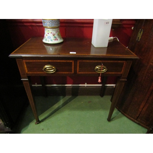 4034 - An Edwardian crossbanded mahogany side table the two frieze drawers with working key over square tap... 