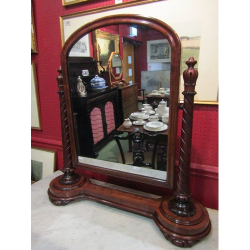 4042 - A William IV mahogany dressing chest tilting mirror with carved and spiral turned supports, on a cir... 