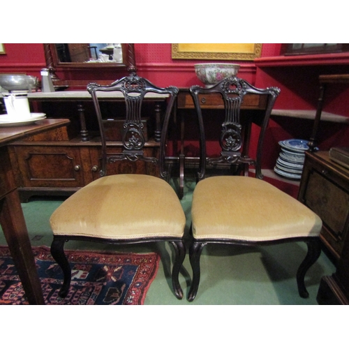 4066 - A pair of Edwardian upholstered bedroom chairs on cabriole fore legs