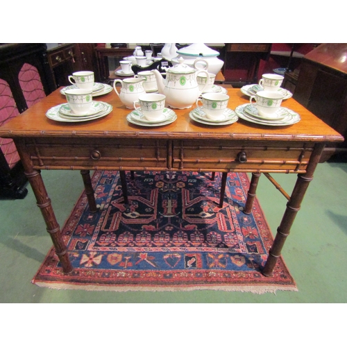 4070 - A Victorian Howard & Sons, Berners St. two drawer bamboo effect side table, marked to drawer, missin... 