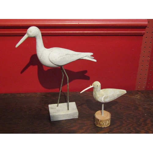 4093 - A figure of an avocet, 30cm tall, together with a smaller wooden carved sea bird (2)