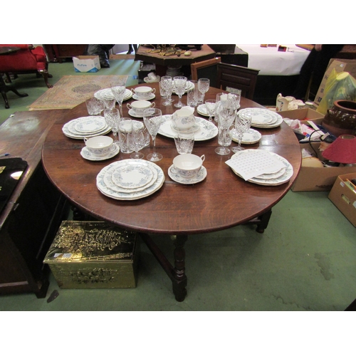 4110 - An 18th Century oak gateleg dining table the rising leaves over a single end cutlery drawer on turne... 