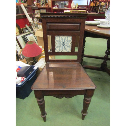 4111 - An Edwardian oak tiled back hall chair