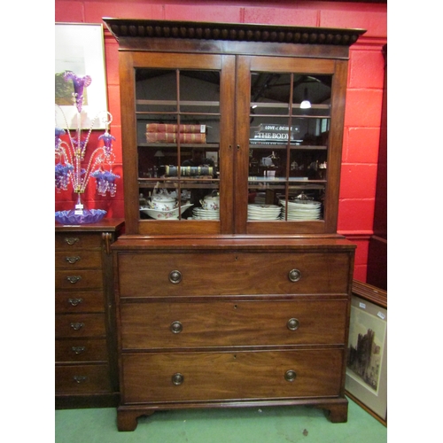 4129 - A late George III flame mahogany library secretaire bookcase with cotton reel moulded cornice, the p... 