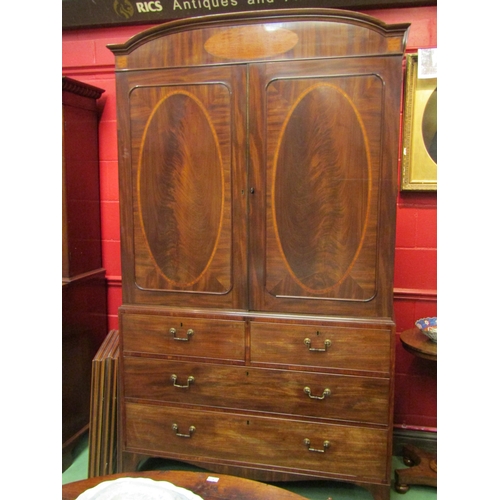 4136 - A William IV flame mahogany linen press with crossbanded inlay, the two doors with key opening to re... 