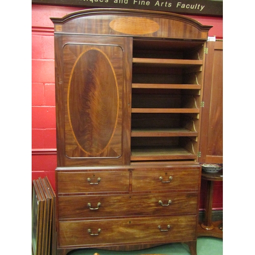 4136 - A William IV flame mahogany linen press with crossbanded inlay, the two doors with key opening to re... 