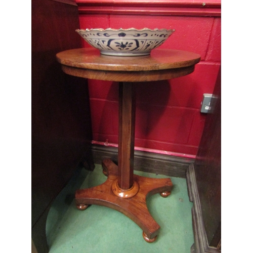 4139 - A 19th Century flame mahogany circular top wine table over a tapering chamfered column and plateau b... 