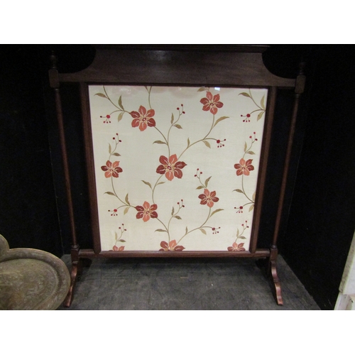 4159 - A mahogany fire screen with silkwork floral design panel, 83cm tall x 76cm wide