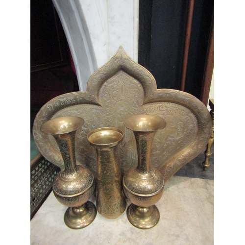 4160 - An Indian brass fan shaped tray together with a pair of vases and another, all with foliate design (... 