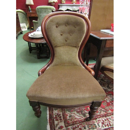 4181 - A mid-Victorian carved walnut button back armchair over turned and reeded fore legs on ceramic casto... 