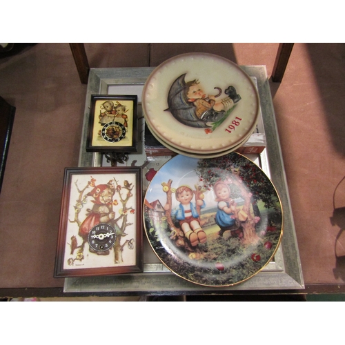 4234 - A collection of Goebel Hummel items including tapestry, two clocks, plates and price guide