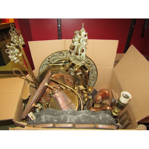 4245 - Two boxes of mixed brass and copper ware to include horse brasses, chargers, fire tools and a table ... 