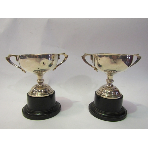 4333 - Two miniature silver twin handled trophies, 126g total