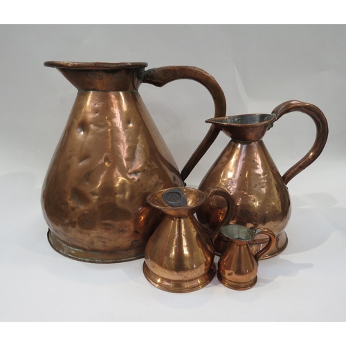 9150 - A set of four copper jugs