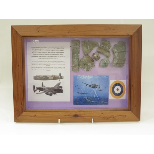 9157 - A framed display of RAF Lancaster bomber aircraft crash items with research relating to Lancaster DS... 