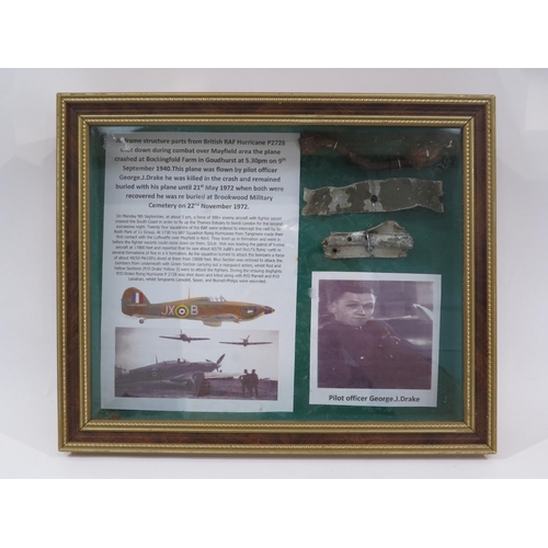 9163 - A framed display of RAF Spitfire crash items with research